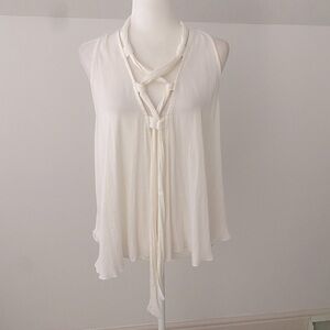 Intimately by Free People flowy tank with lace up detail in front.